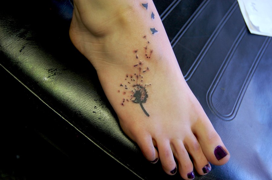 Amazing Dandelion With Flying Bird Tattoo On Girl Foot