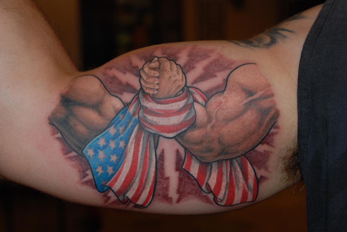 Arm Wrestling With USA Flag Tattoo On Bicep.