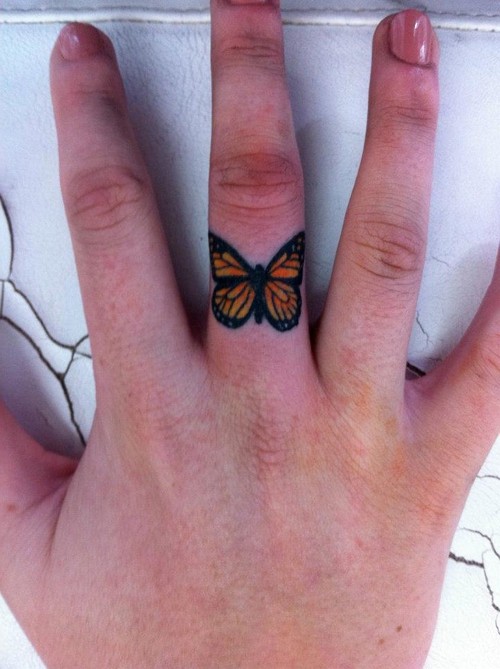 Beautiful Butterfly Tattoo On Middle Finger