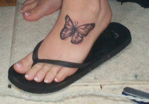 Black And Grey Butterfly Tattoo On Foot