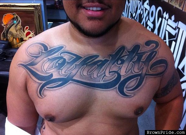 Black And Grey Loyalty Tattoo On Man Chest