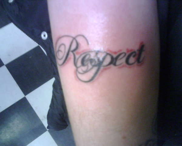 Black And Grey Respect Tattoo On Right Arm