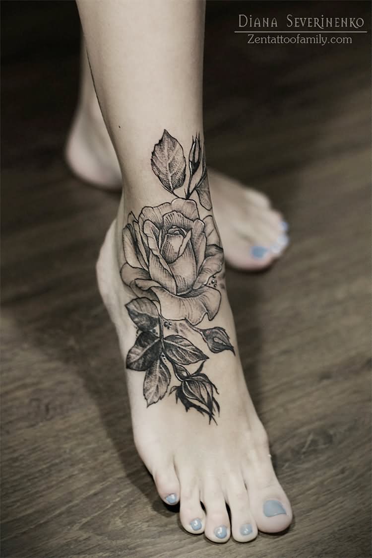 Black And Grey Rose With Leaves Tattoo On Girl Foot