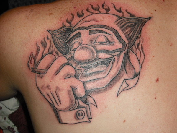 Black And Grey Smoking Clown Tattoo On Left Back Shoulder