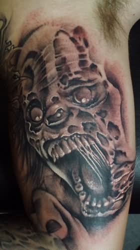 Black And Grey Zombie Clown Head Tattoo Design For Bicep