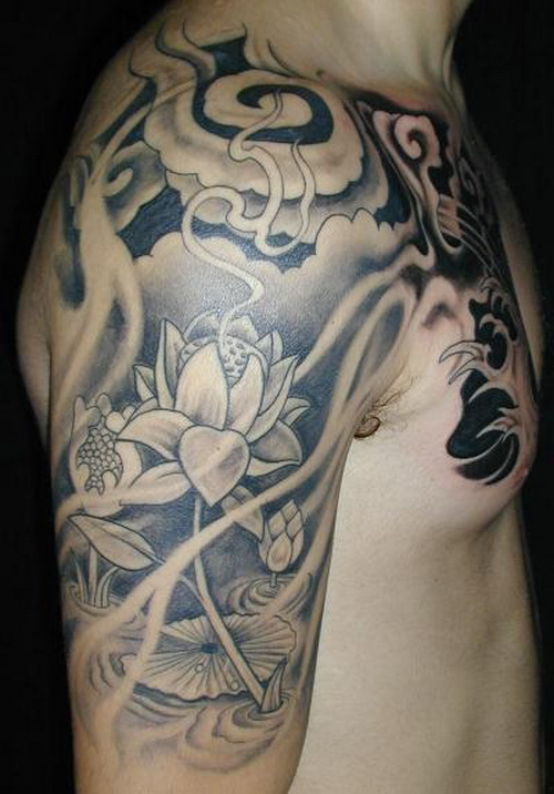 Black And White Japanese Lotus Flower Tattoo On Man Chest And Half Sleeve