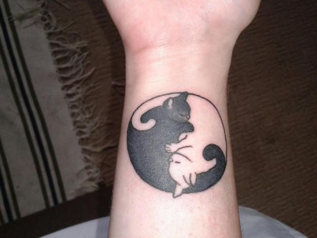 Black And White Yin Yang Cat Tattoo On Wrist