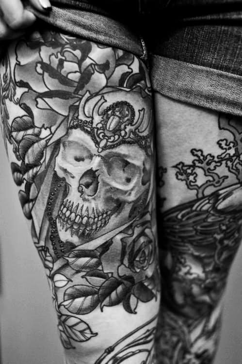 Black And White skull With Flowers Tattoo On Thigh