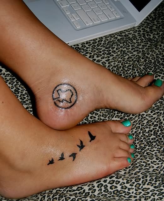 Black Flying Bird Tattoo On Girl Feet