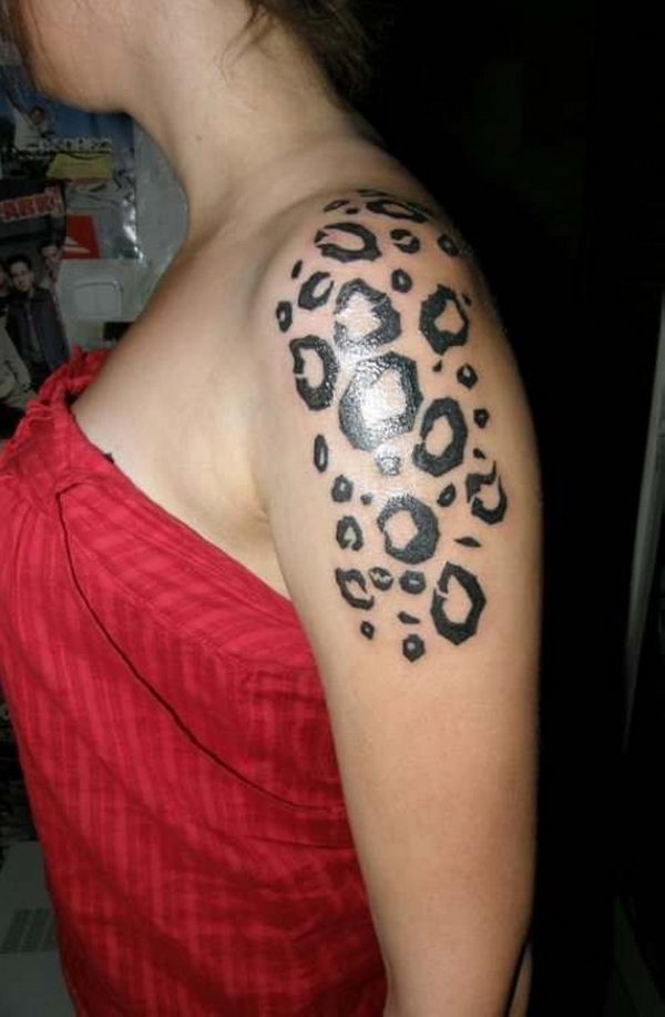 Black Ink Cheetah Print Tattoo On Girl Left Shoulder
