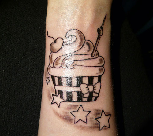 Black Ink Cupcake With Stars Tattoo Design For Forearm