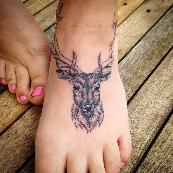 Black Ink Deer Head Tattoo On Girl Foot