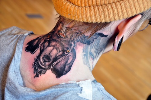 Black Ink Goat Head Tattoo On Girl Back Neck