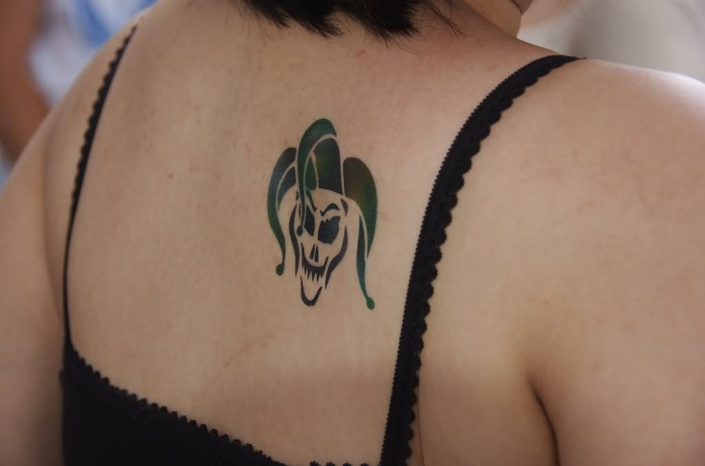 Black Jester Clown Head Tattoo On Upper Back