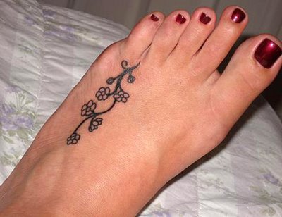 Black Little Flowers Tattoo On Girl Foot