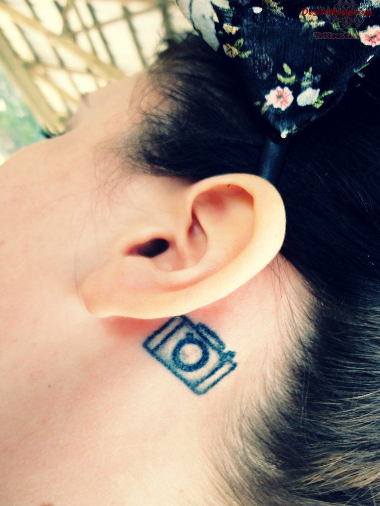 Black Little Movie Camera Tattoo On Girl Behind The Ear