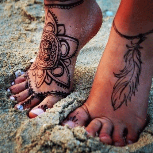 Black Mandala Flower And Feather Tattoo On Feet