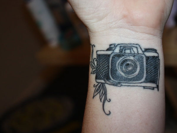 Black Movie Camera Tattoo On Forearm