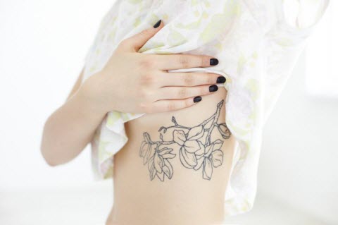 Black Outline Flowers Tattoo On Under Breast