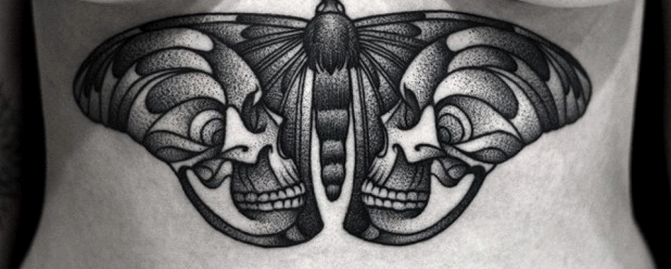 Black Skull In Buttery Wings Tattoo On Under Breast