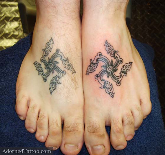 Black Swastika Tattoo On Feet