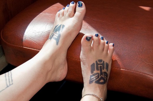 Black Transformers Logo Tattoo On Girl Feet