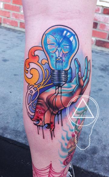 Blue Bulb In Hand Tattoo On Back Leg