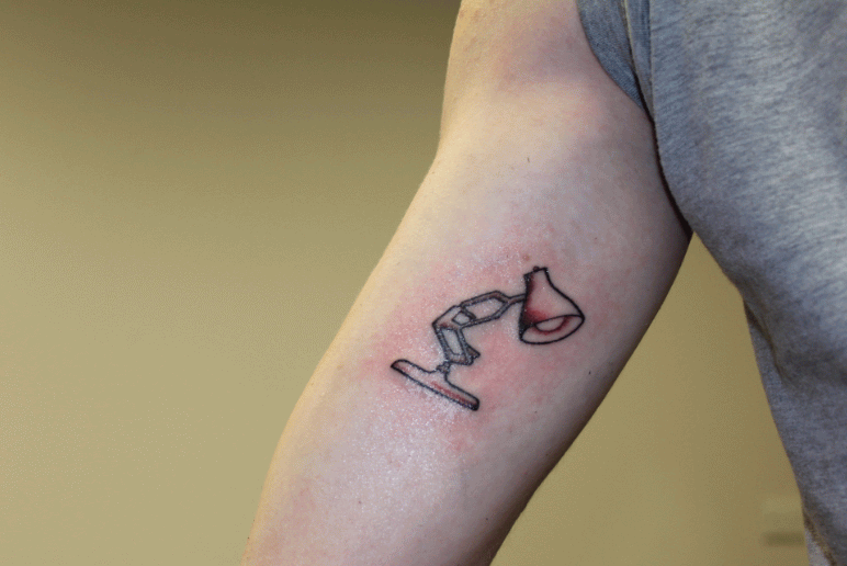 Bulb In Lamp Tattoo On Inner Bicep