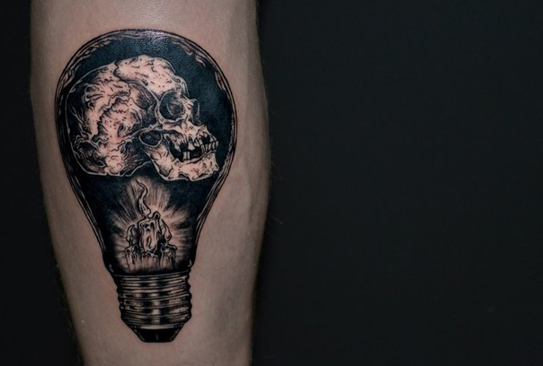 Burning Candle And Skull In Bulb Tattoo On Sleeve