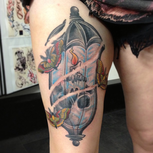 Burning Candle In Light Lamp Tattoo On Right Thigh