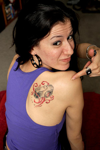 Camera Tattoo On Girl Right Back Shoulder