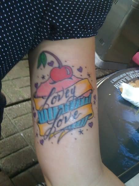 Cherry Cupcake With Banner Tattoo On Bicep
