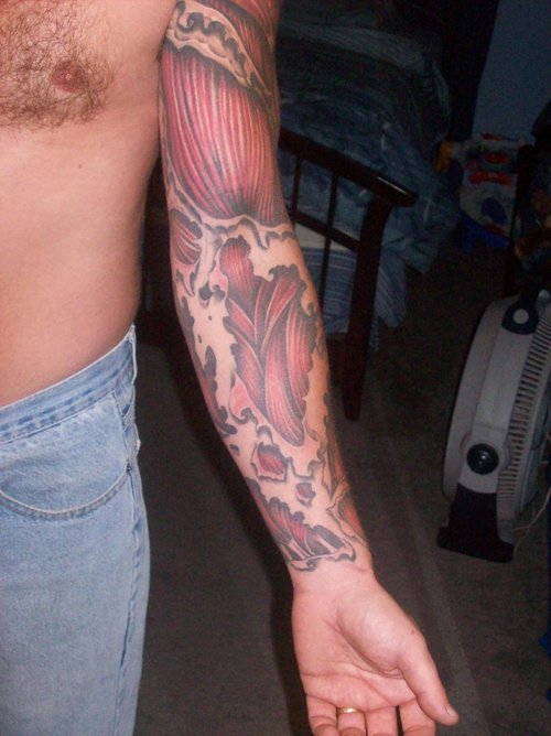 Classic Ripped Skin Muscle Tattoo On Man Left Full Sleeve