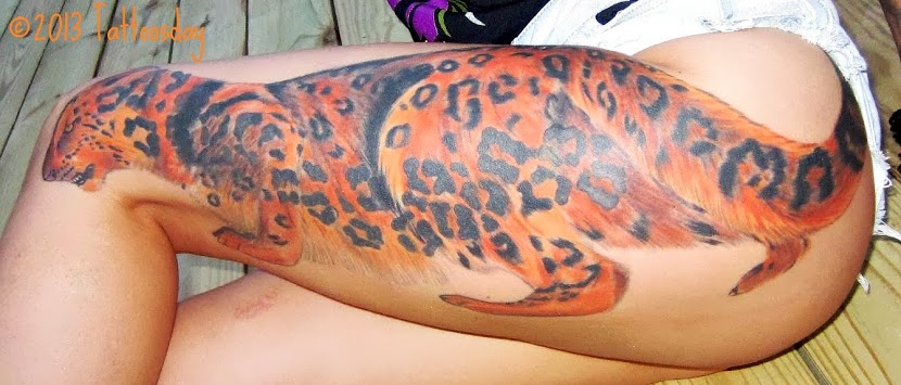 Colored Cheetah Tattoo On Girl Left Leg