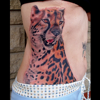 Colored Cheetah Tattoo On Girl Rib Side
