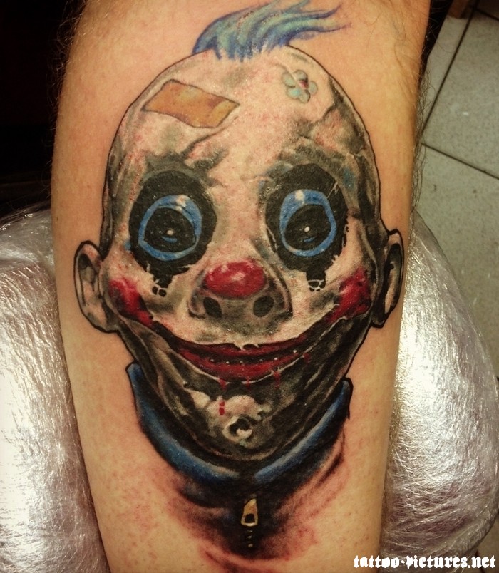 Colorful Clown Baby Head Tattoo Design
