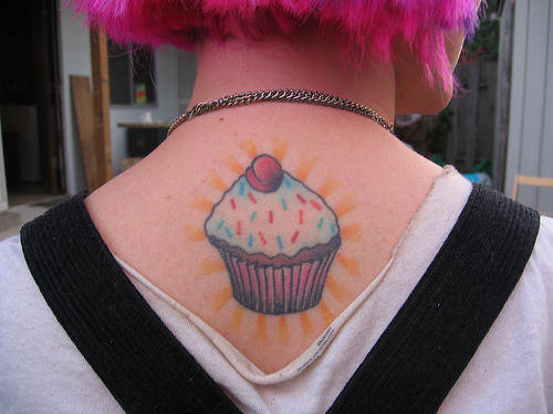 Colorful Cupcake Tattoo On Girl Upper Back