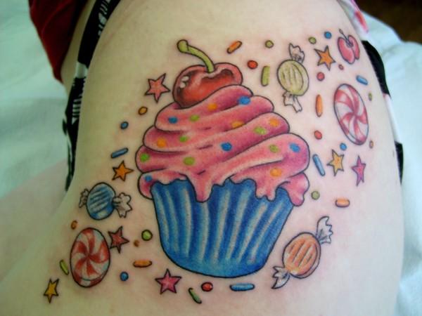 Colorful Cupcake With Candies Tattoo Design For Side Rib