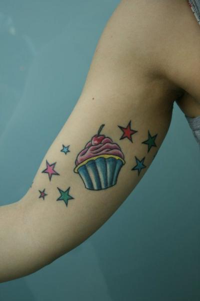 Colorful Cupcake With Stars Tattoo On Bicep