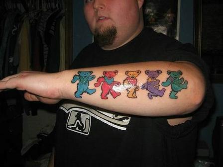 Colorful Five Teddy Bear Tattoo On Forearm
