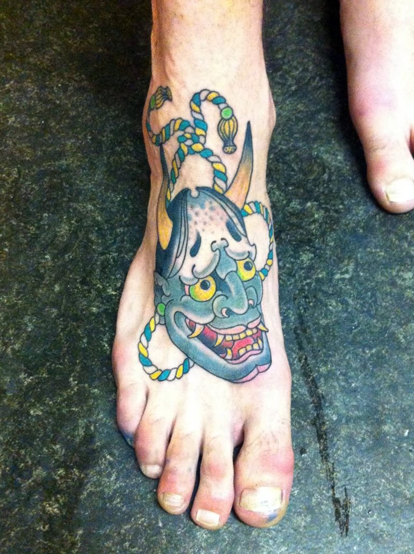 Colorful Hanya Head Tattoo On Foot