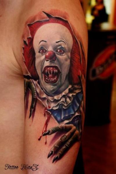 Colorful Ripped Skin Clown Tattoo On Man Left Shoulder