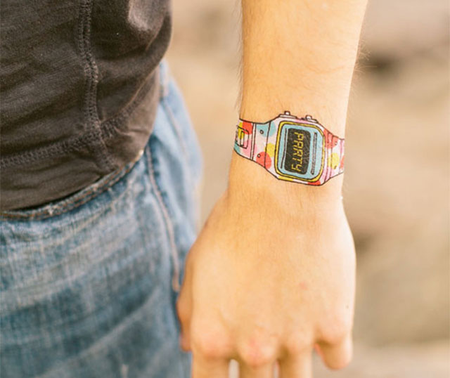 Colorful Wrist Watch Tattoo On Upper Wrist