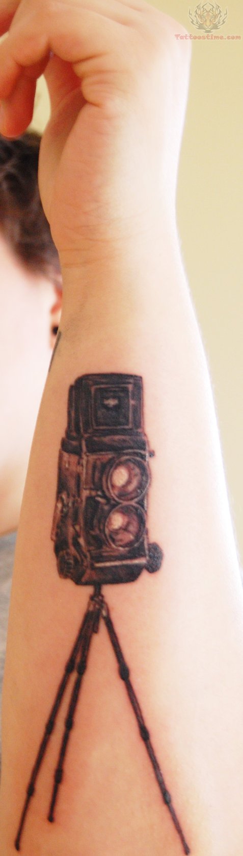 Cool Black Ink Movie Camera Tattoo On Forearm