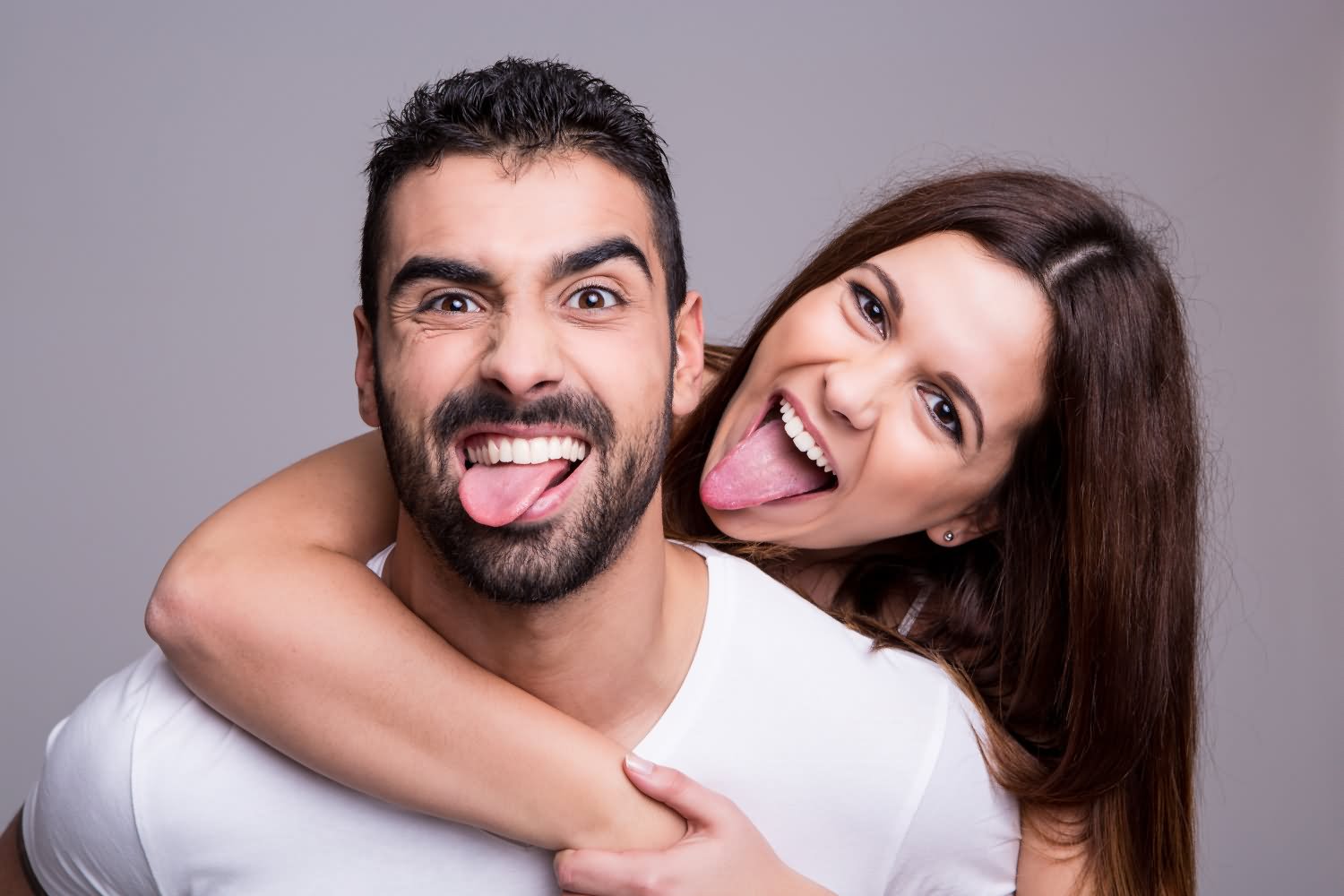 Couple Showing Funny Tongue