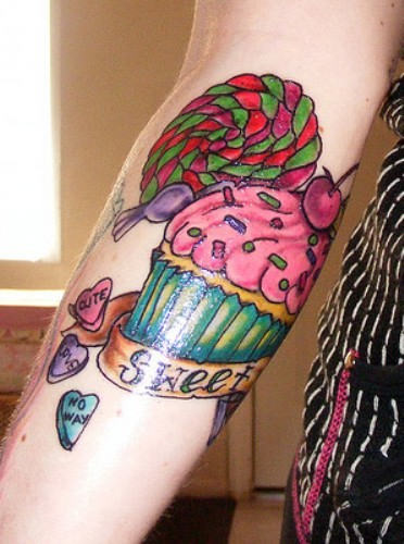 Cupcake With Banner And Candy Tattoo Design For Forearm