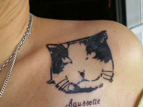 Cute Black And White Cat Head Tattoo On Collarbone