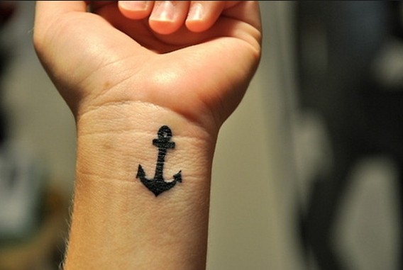 Cute Black Ink Anchor Tattoo On Wrist