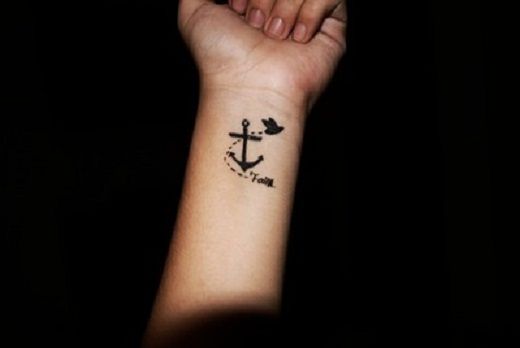 Cute Flying Bird And Anchor Tattoo On Left Wrist