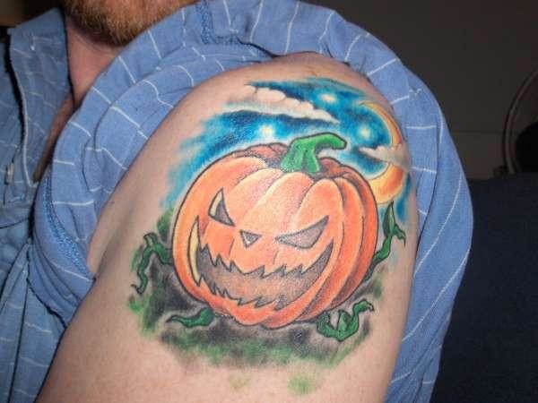 Evil Pumpkin Tattoo On Left Shoulder